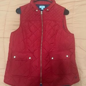 Red quilted vest with gold details and 4 pockets